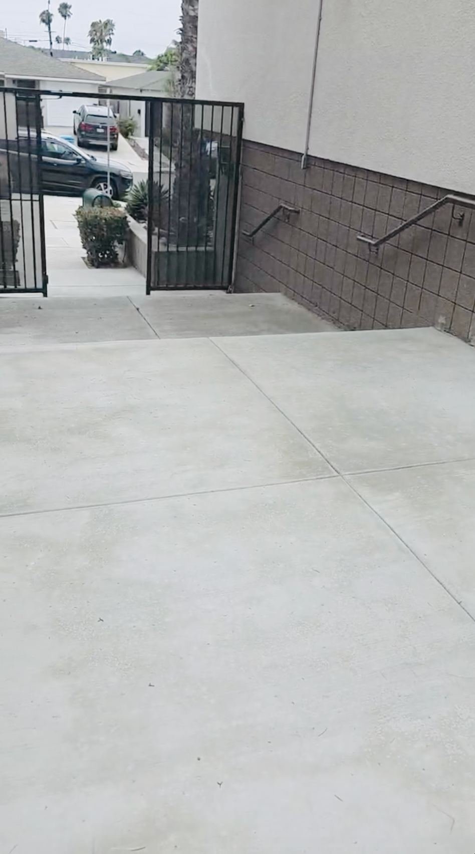 Finished concrete flatwork and walkway poured by Cordada Construction at a Vista, California property