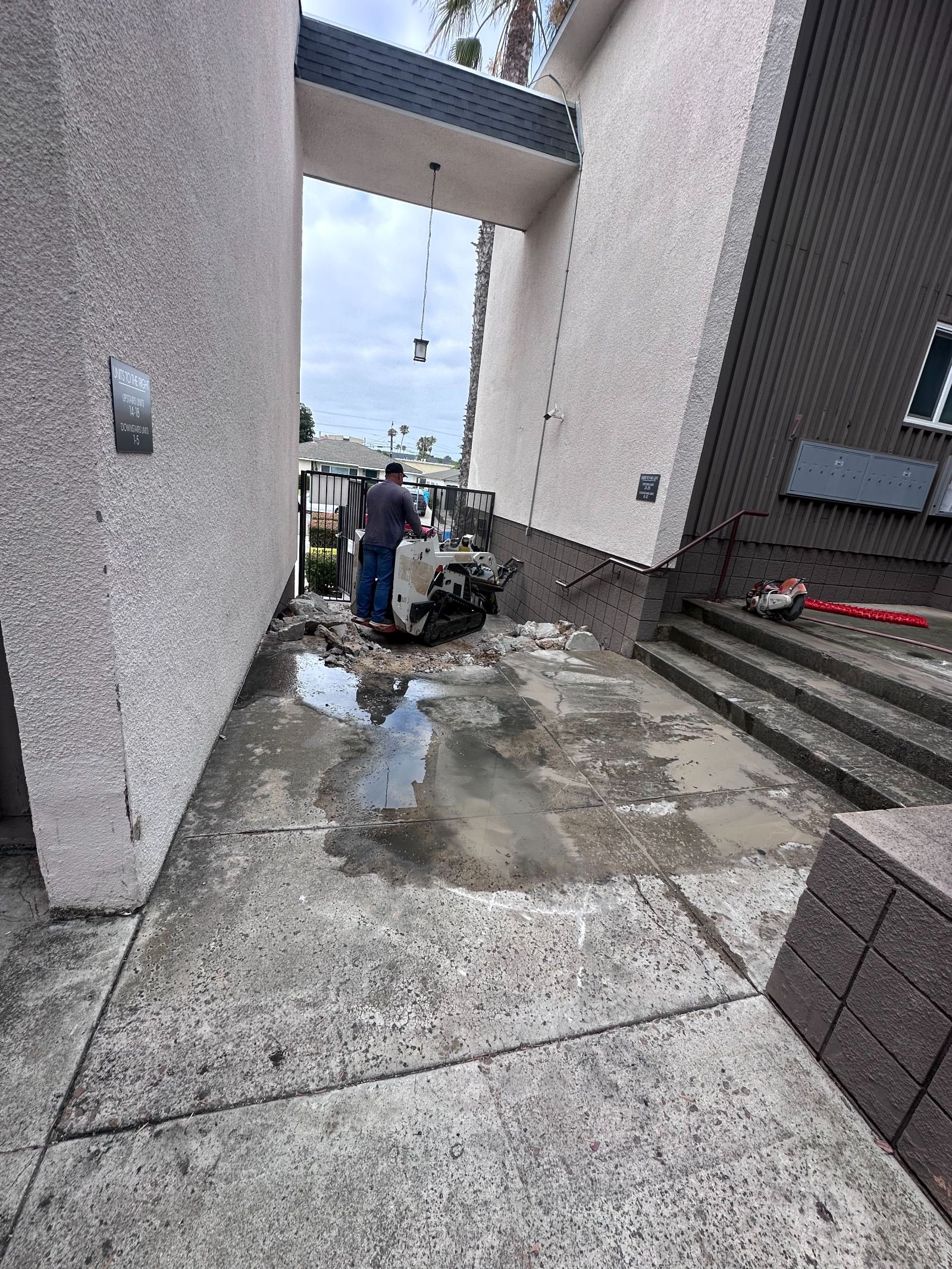 Concrete walkway and steps removed and the base prepared for replacement concrete, Vista CA